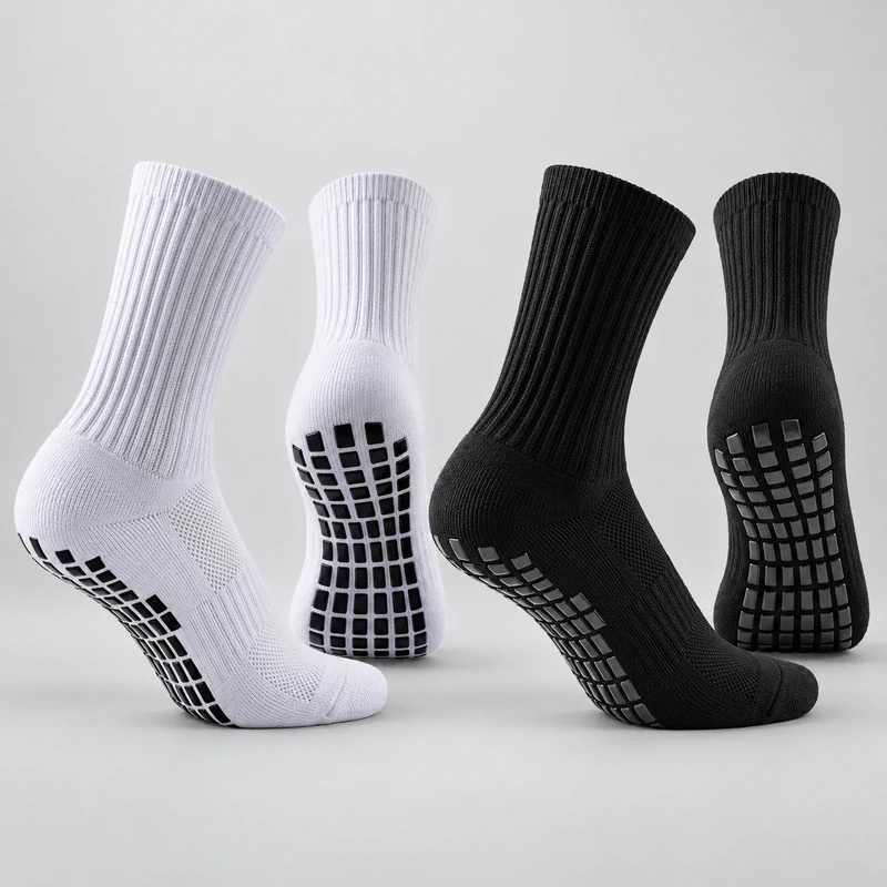 White and black crew football grip socks with ribbed legs and square-pattern sole grip pads