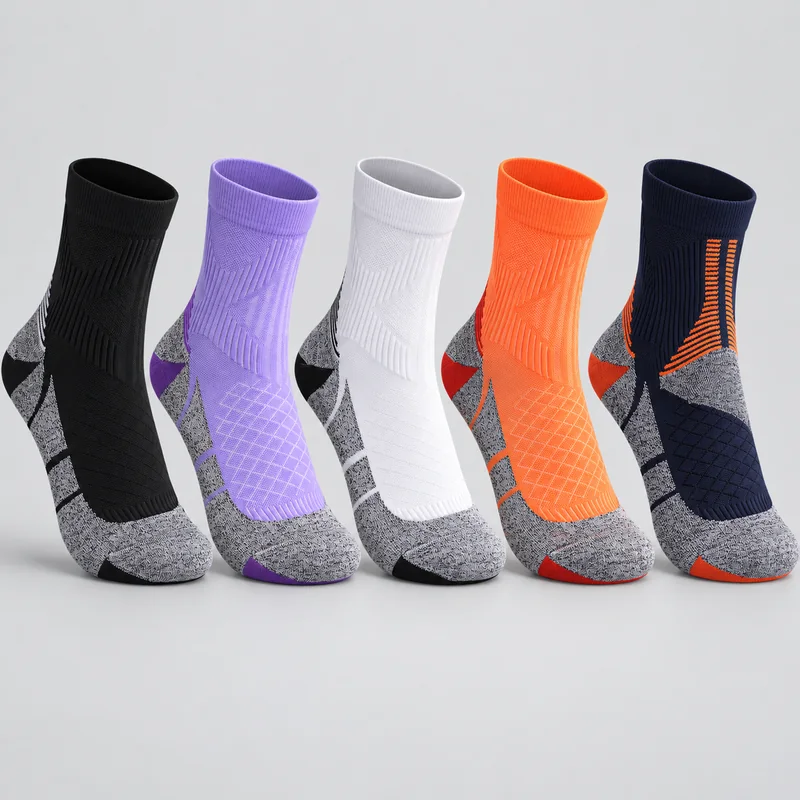 Five unbranded crew sports socks in black, lavender, white, orange and navy with grey heather foot panels and contrasting heel and toe details